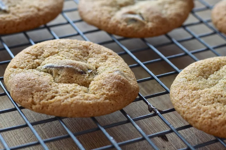 Freshly baked homemade cookies cooling on a wire rack