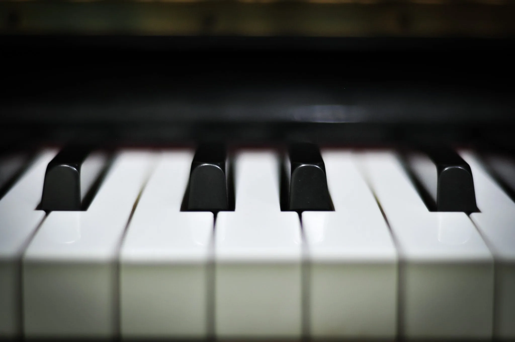 Close-up of piano keys in warm light