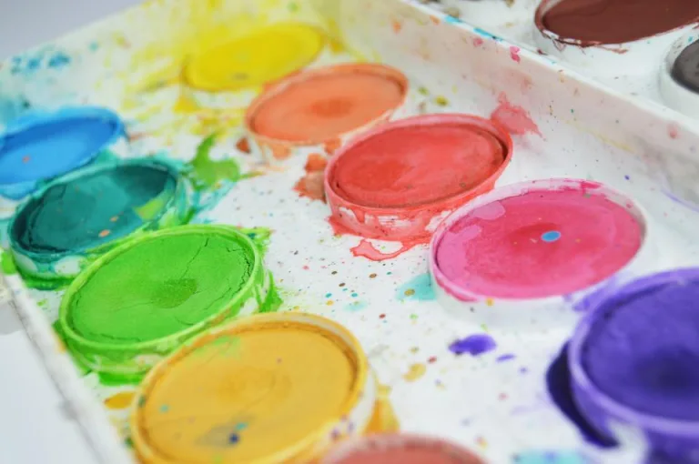 A watercolor paint palette with bright colors