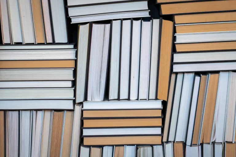 Stacks of used books with cream-colored page edges